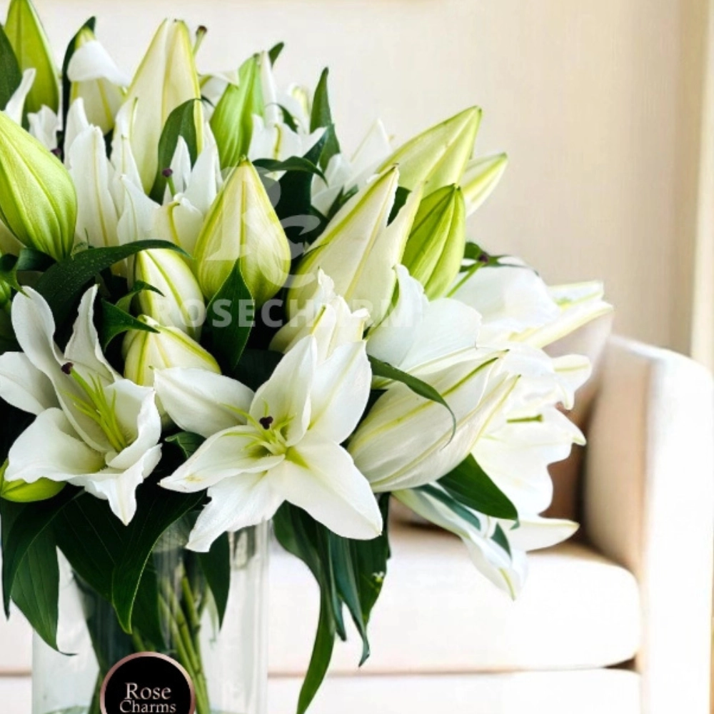 Arrangement of 10 white lilies in a glass vase