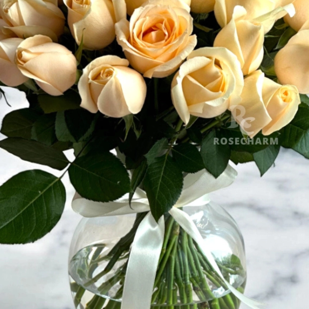 Peach roses in a glass vase