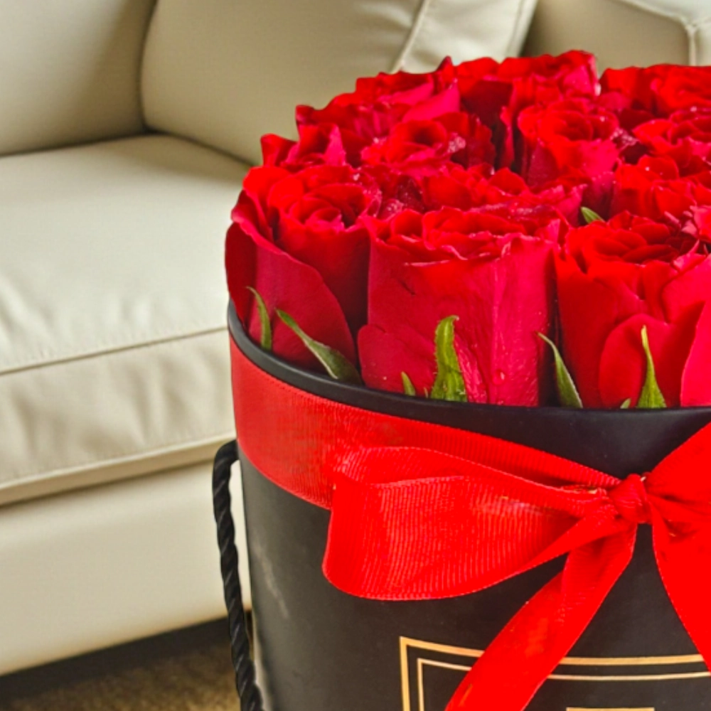 Arrangement of 20 red roses in a black box