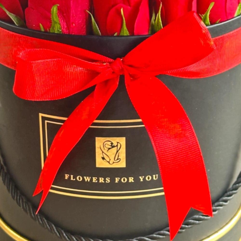 Arrangement of 20 red roses in a black box
