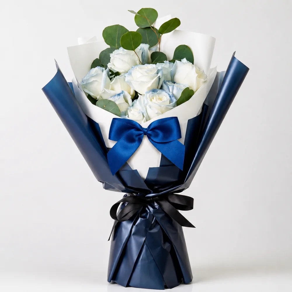 Elegant Father's Day bouquet featuring 11 white roses with soft blue accents, beautifully arranged to express love, respect, and heartfelt gratitude for fathers