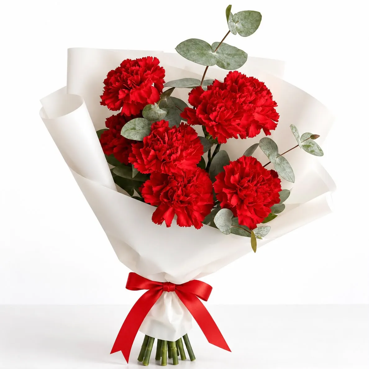 Lovely 7 Red Carnations Bouquet for Same Day Delivery featuring seven vibrant red carnations hand-tied elegantly