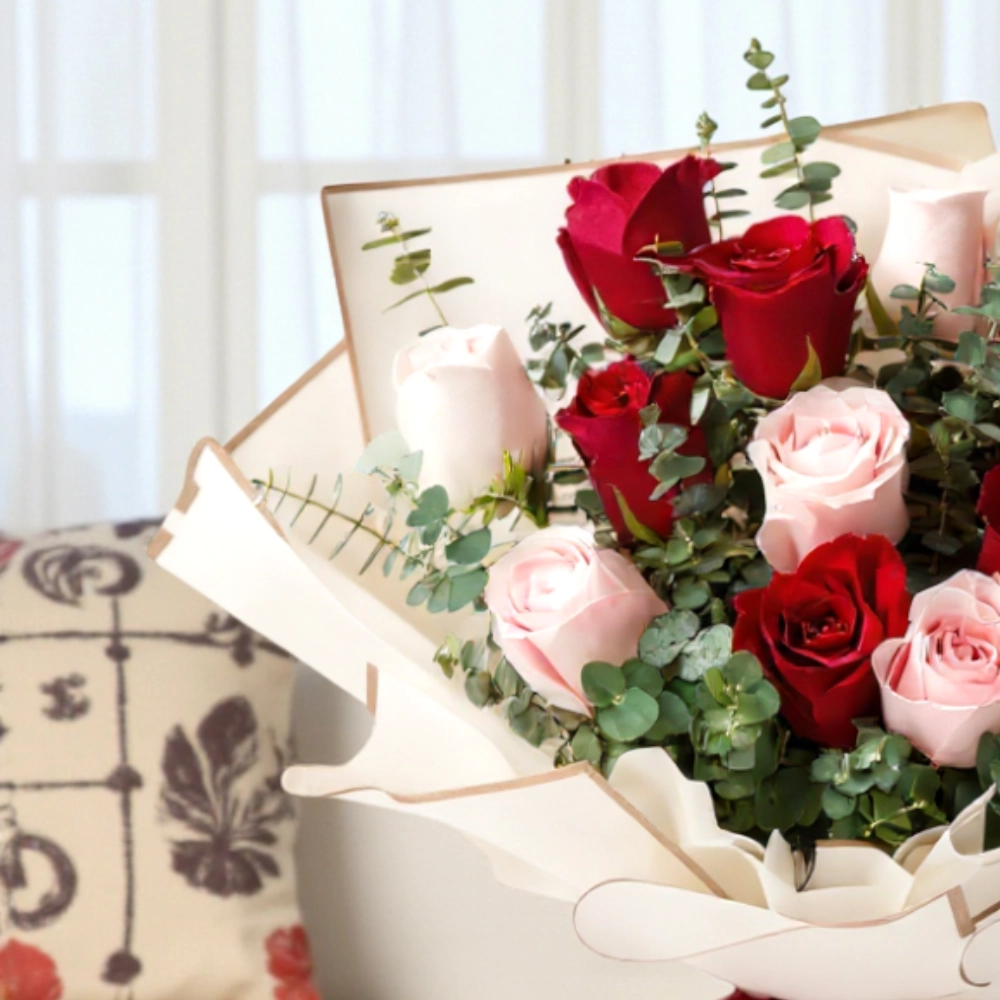 A Bouquet of 12 red and pink roses in a nice wrapping
