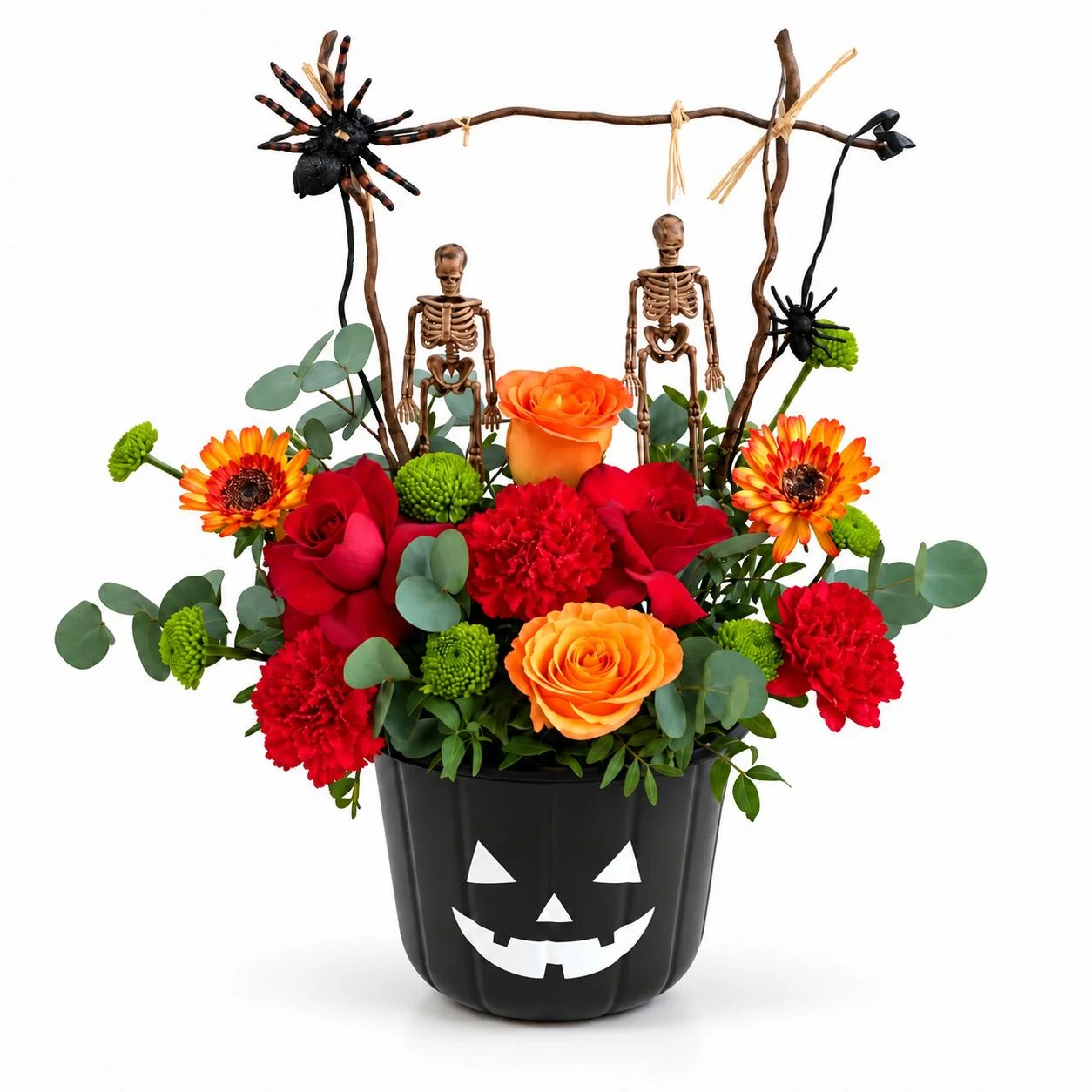 Spooky Elegance Bucket of red and orange roses, carnations and gerberas styled with Halloween skeletons and spider