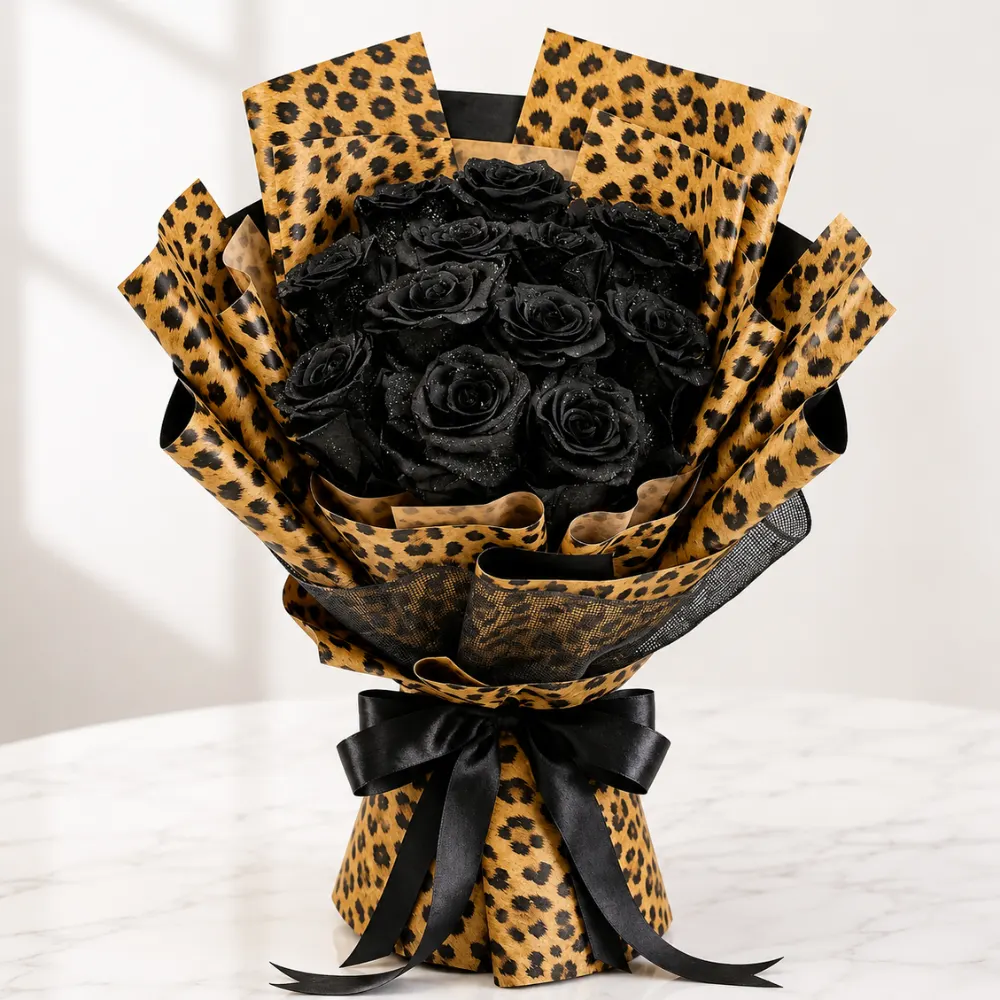 Elegant bouquet of 11 black roses in premium cheetah wrapping designed as a stylish Father's Day gift for dad