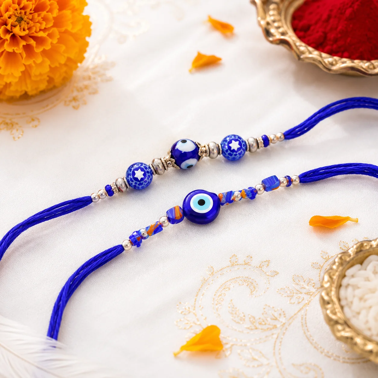 Blue evil eye rakhi set of 2 with premium beads, silver accents and royal blue thread for Raksha Bandhan