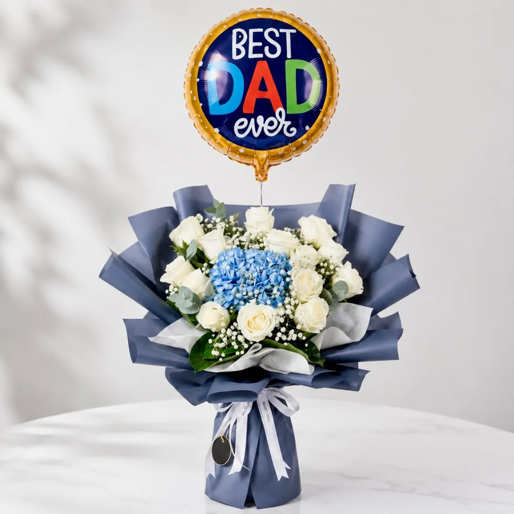 Elegant Father's Day bouquet featuring white roses, blue hydrangea, and a Best Dad foil balloon